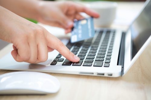 Hand With Credit Card Laptop 